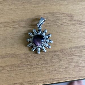Amethyst and sterling silver pendant.